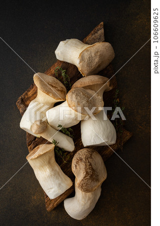Eryngii mushrooms on a cutting board 106609625