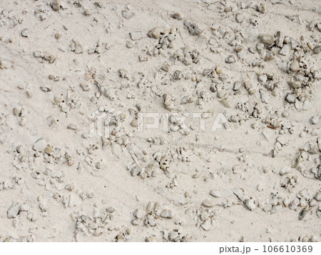 The textured surface of the concrete wall with a blue arrow indicate the direction. Abstract background. The textured surface of the concrete wall with a blue arrow indicate the direction. Abstract background. 106610369