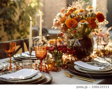 Beautiful fall table setting, autumn dinner table decoration with flowers and candles, holiday event decor in orange and yellow colors Beautiful fall table setting, autumn dinner table decoration with flowers and candles, holiday event decor in orange and yellow colors 106610553