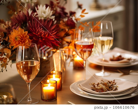 Beautiful fall table setting, autumn dinner table decoration with flowers and candles, holiday event decor in orange and yellow colors Beautiful fall table setting, autumn dinner table decoration with flowers and candles, holiday event decor in orange and yellow colors 106610676