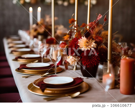 Beautiful fall table setting, autumn dinner table decoration with flowers and candles, holiday event decor in orange and yellow colors 106610677