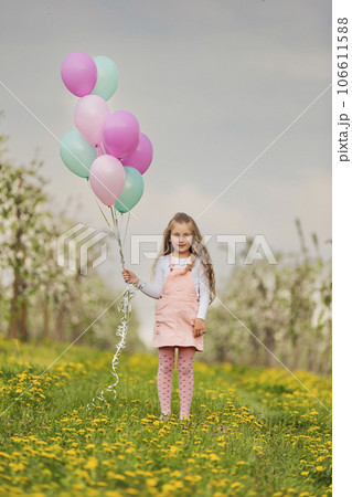 girl with colorful balloons 106611588