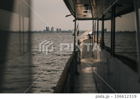 Calm boat trip in the sea near the city. Calm boat trip in the sea near the city. 106612319