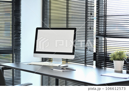 Blank screen computer with keyboard, diary and potted plant on black office desk Blank screen computer with keyboard, diary and potted plant on black office desk 106612573