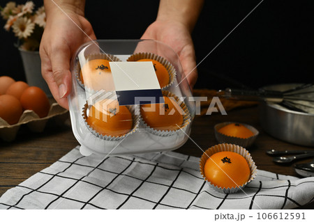 Traditional dessert for Chinese Mid-Autumn festival. Chinese pastry with stuffed salted yolk on wooden kitchen table Traditional dessert for Chinese Mid-Autumn festival. Chinese pastry with stuffed salted yolk on wooden kitchen table 106612591