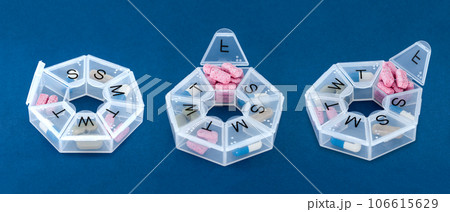 Set of weekly pill organizers. Three colorful containers for every day, the concept of taking medication. 106615629