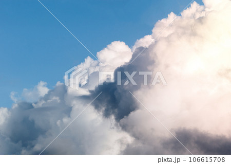 Dark stormy clouds on blue sky background. Dark stormy clouds on blue sky background. 106615708