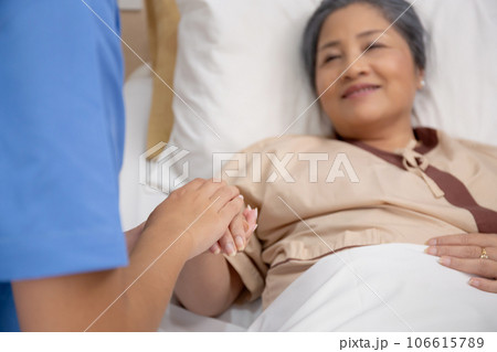Closeup hands of doctor woman encourage with elderly patient at the hospital. Closeup hands of doctor woman encourage with elderly patient at the hospital. 106615789