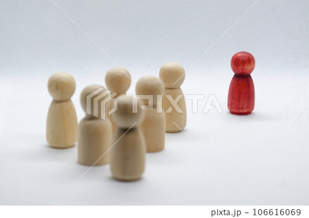 Red wooden figure leading other wooden figures reaching. Leadership concept. Red wooden figure leading other wooden figures reaching. Leadership concept. 106616069