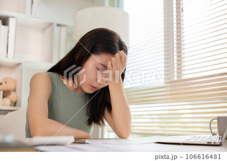 Young woman stressed or worried about doing a wrong job, Despair or disappointment, Sad feeling, Suffering, Desperate, Hopeless, Fail, disastrous, bankrupt, Scared, panicky, Failure of life. 106616481