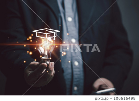 Marketer holding a bright light bulb full of educational ideas marketing concepts for educational services. Marketer holding a bright light bulb full of educational ideas marketing concepts for educational services. 106616499