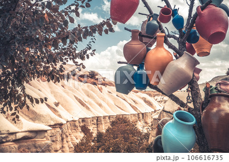 Colorful vases hanging on tree branch Colorful vases hanging on tree branch 106616735