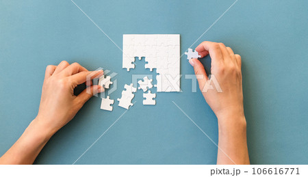 Hands with Small white square puzzle 106616771