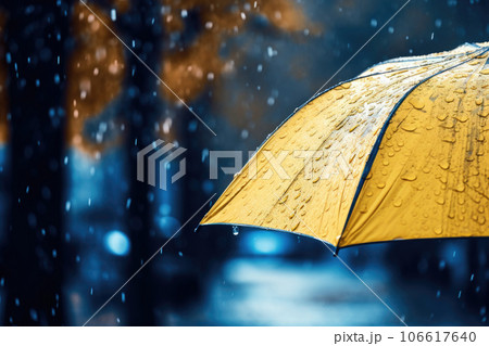 Yellow umbrella under the rain 106617640