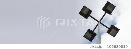 A view from below of the led lamp that illuminates streets in the city. 106620839