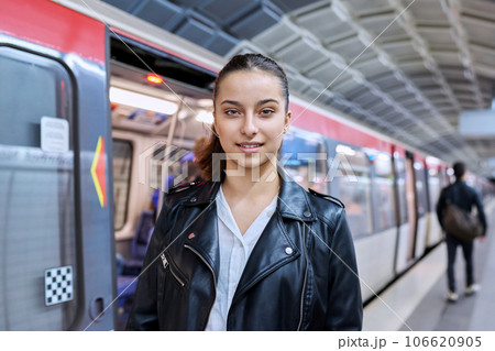 Teenage girl on platform of subway station 106620905