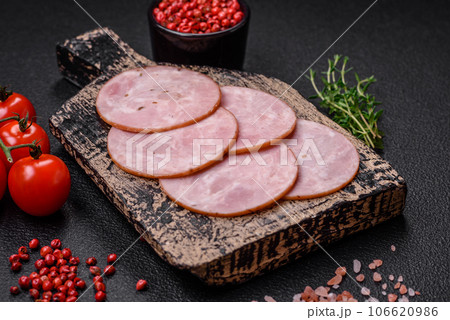 Delicious fresh ham cut into round slices with salt, spices and herbs 106620986