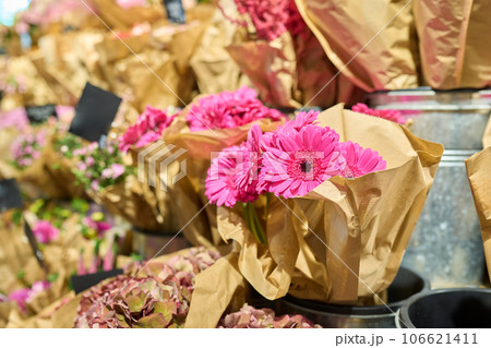 Flower shop, close-up of fresh flowers in buckets, pink gerberas 106621411
