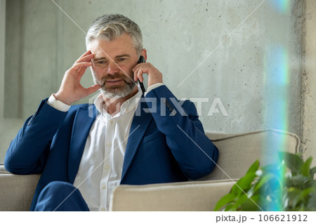 Mature business man in office talking on cell phone, professional executive manager speaking smartphone. 106621912