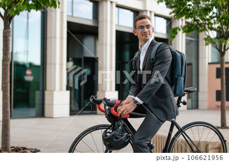 Young manager coming to the office by bike 106621956