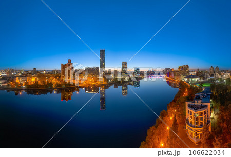 Yekaterinburg city and pond aerial panoramic view at summer or early autumn night. Night city in the early autumn or summer. 106622034