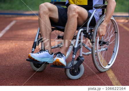 Disabled man in wheelchair at basketball court. 106622164
