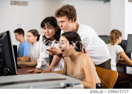 Surprised teenagers looking at the screen of PC while learning the computer science in the classroom 106625717