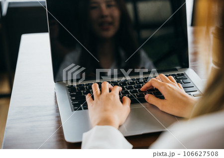 Happy beautiful freelancer blogger typing keyboard on laptop for writing blog web page, working online, Asian young business woman lifestyle sitting using laptop computer at cafe coffee shop 106627508