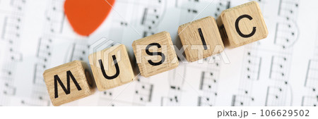 Music word collected from wooden cubes and musical notes 106629502