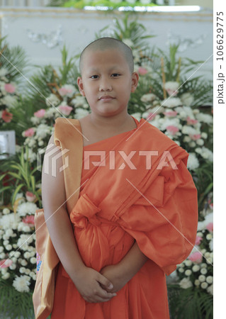 portrait of buddhist novice wearing thai monk clothes standing outdoor portrait of buddhist novice wearing thai monk clothes standing outdoor 106629775