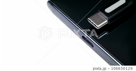 USB Type C cable, Type-C port connector on white background, power charger port of mobile phone. USB Type C cable, Type-C port connector on white background, power charger port of mobile phone. 106630129