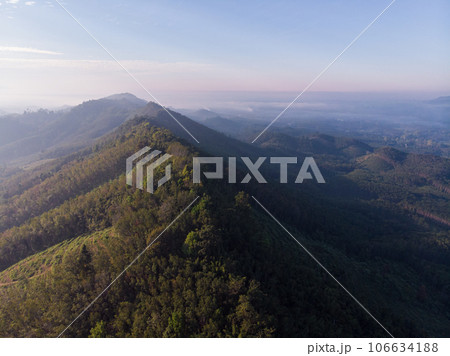Aerial view mountain sunrise with fog sunrise light morning Aerial view mountain sunrise with fog sunrise light morning 106634188