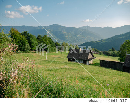 Old authentic wood house Carpathian mountains Ukraine, Europe. Local countryside travel hiking forest trails Cottagecore Old authentic wood house Carpathian mountains Ukraine, Europe. Local countryside travel hiking forest trails Cottagecore 106634357