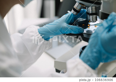 Science and medicine, scientist analyzing and dropping a sample into a glassware, experiments containing chemical liquid in laboratory on glassware, innovative and technology. Science and medicine, scientist analyzing and dropping a sample into a glassware, experiments containing chemical liquid in laboratory on glassware, innovative and technology. 106636986