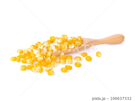 canned corn on a wood spoon on white background. dersert for children . canned corn on a wood spoon on white background. dersert for children . 106637332