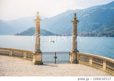 Ornamental gate with roman columns to Como Lake, Italian: Lago di Como, Bellagio, Lombardy, Italy Ornamental gate with roman columns to Como Lake, Italian: Lago di Como, Bellagio, Lombardy, Italy 106638517