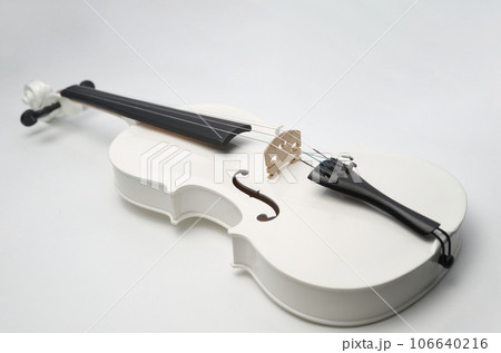 White violin on a gray background White violin on a gray background 106640216