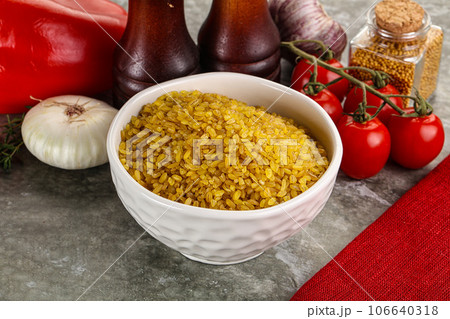 Dry wheat bulgur cereal heap 106640318