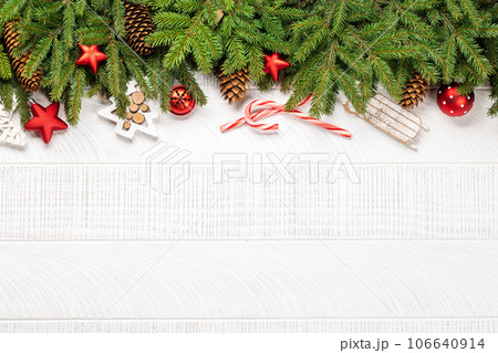 Christmas fir tree branch with decor and space Christmas fir tree branch with decor and space 106640914