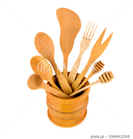 Set of wooden kitchenware isolated on white background. Set of wooden kitchenware isolated on white background. 106642268
