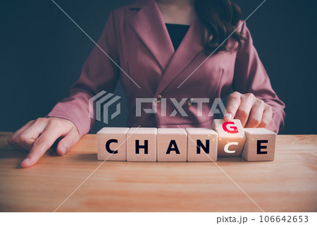 Businesswoman hand flipping wooden blocks with CHANGE to CHANCE text. Economy investment business crisis, technology transformation can make good chance, strategy, solution, positive thinking concept. 106642653