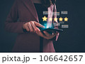 Close up woman hand using digital tablet or smartphone with popup five stars icon for feedback review satisfaction service. Customer service experience and business satisfaction survey. Close up woman hand using digital tablet or smartphone with popup five stars icon for feedback review satisfaction service. Customer service experience and business satisfaction survey. 106642657