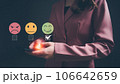 Woman using smartphone choosing green happy smile face icon. feedback rating and positive customer review experience, Concept of satisfaction survey, mental health assessment, world mental health day. Woman using smartphone choosing green happy smile face icon. feedback rating and positive customer review experience, Concept of satisfaction survey, mental health assessment, world mental health day. 106642659