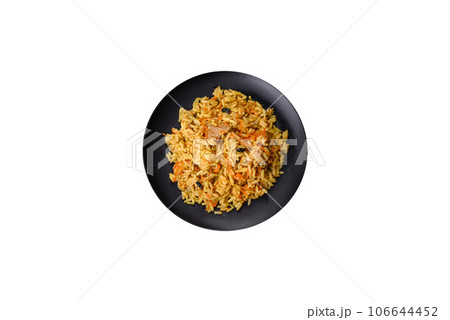 Pilaf or pilau with chicken, traditional uzbek hot dish of boiled rice, chicken meat, vegetables and spices 106644452