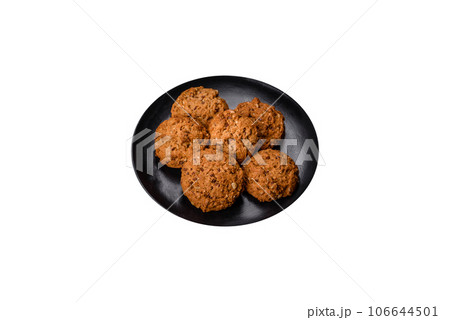 Tasty fresh oat cookies on a dark concrete background 106644501