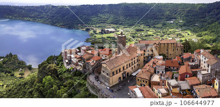Most scenic lakes of Italy - volcanic Lago di Nemi , aerial drone view of Nemi village and volcano crater. popular touristic site near Rome Most scenic lakes of Italy - volcanic Lago di Nemi , aerial drone view of Nemi village and volcano crater. popular touristic site near Rome 106644977