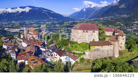 Tourism of northern Italy.  Traditional picturesque mountain village Schenna (Scena) near Merano town in Trentino - Alto Adige region. view of medieval castle, aerial view 106646225