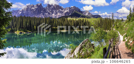 Idyllic nature scenery- trasparent mountain lake Carezza surrounded by Dolomites rocks- one of the most beautiful lakes of Alps. South Tyrol region. Italy 106646265