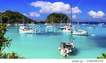 Beautiful small ionian greek island Paxos. view of wonderful scenic beach and bay Lakka with sailng boats. Greece travel Beautiful small ionian greek island Paxos. view of wonderful scenic beach and bay Lakka with sailng boats. Greece travel 106646350