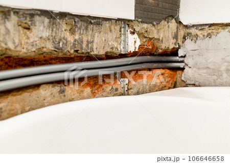 flexible plumbing pipe are routed in chiseled wall 106646658